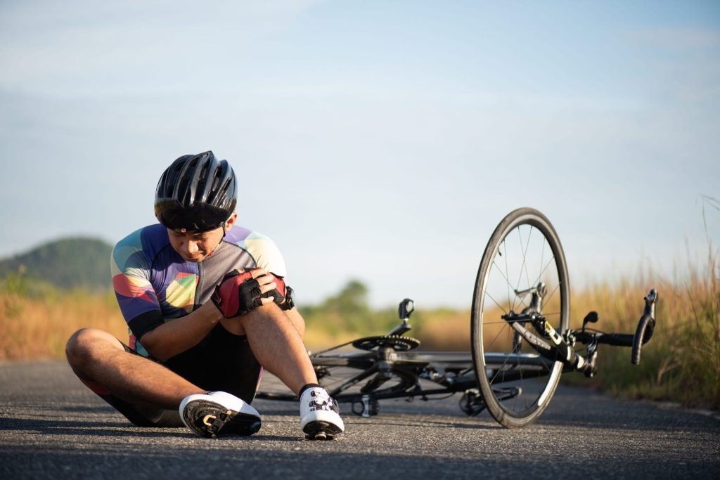 Cyclist With Knee Injury