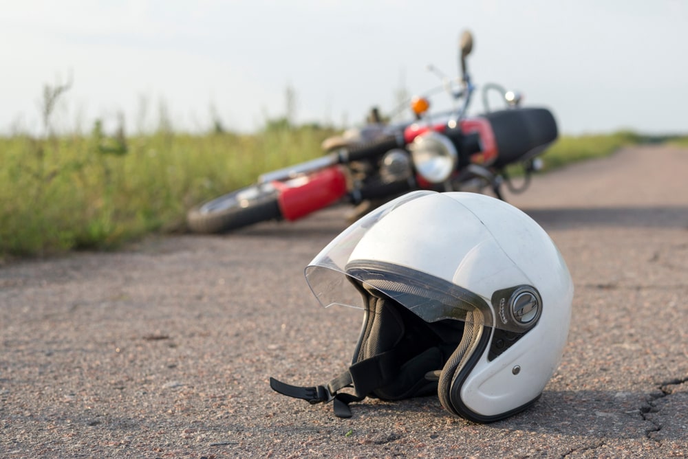 Drivers helmet laying on the road